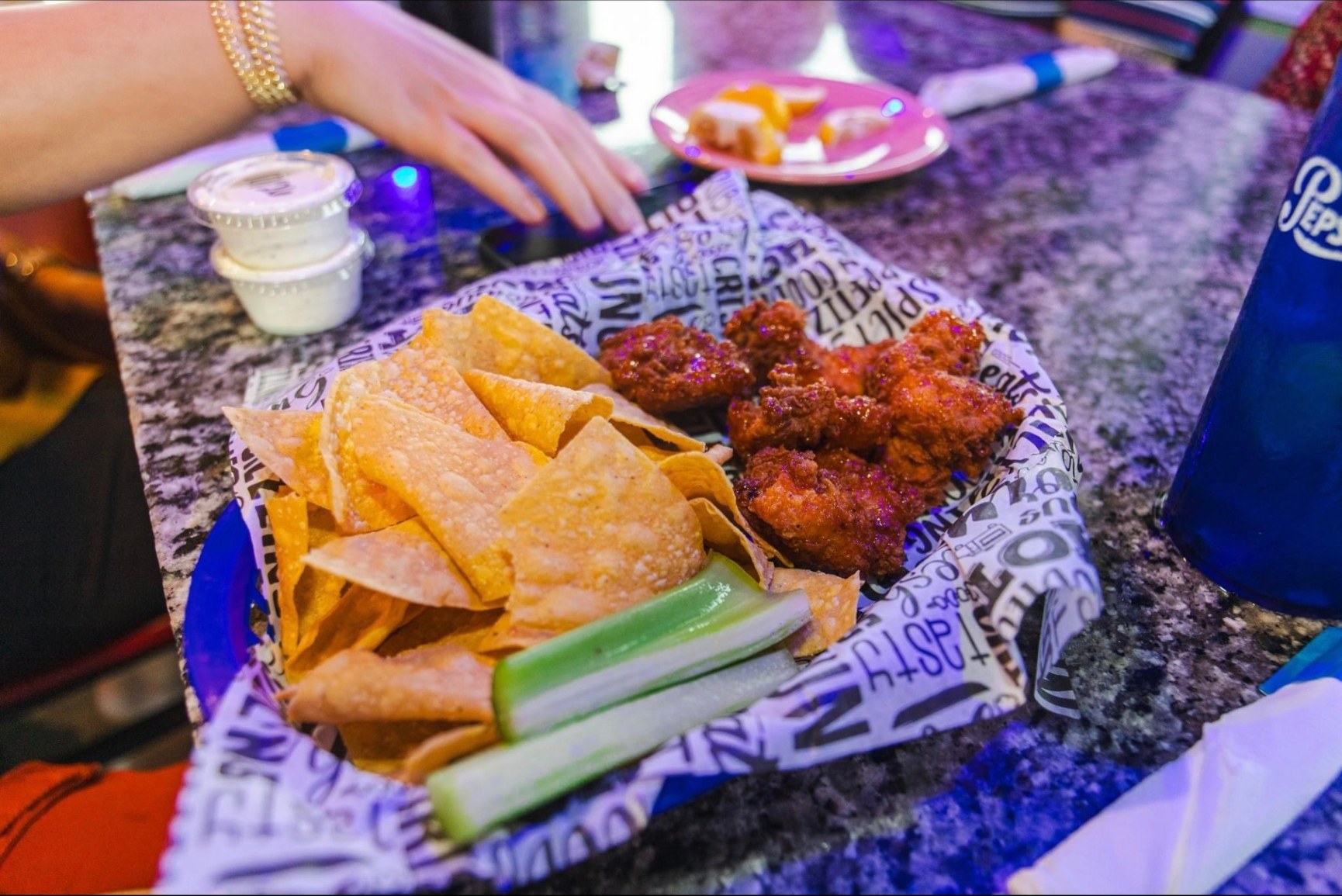 Wings, chips and celery served at The Penguin Bar & Grill